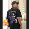 Back view of a male model wearing a black oversized t-shirt featuring Obanai Iguro from Demon Slayer: Kimetsu no Yaiba.