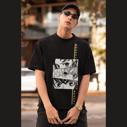 Front view of a male model wearing a black oversized t-shirt featuring Tanjiro Kamado from Demon Slayer: Kimetsu no Yaiba.