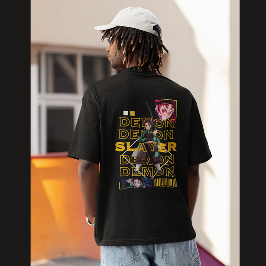 Back view of a male model wearing a black oversized t-shirt featuring Tanjiro Kamado with the text "Demon Slayer."