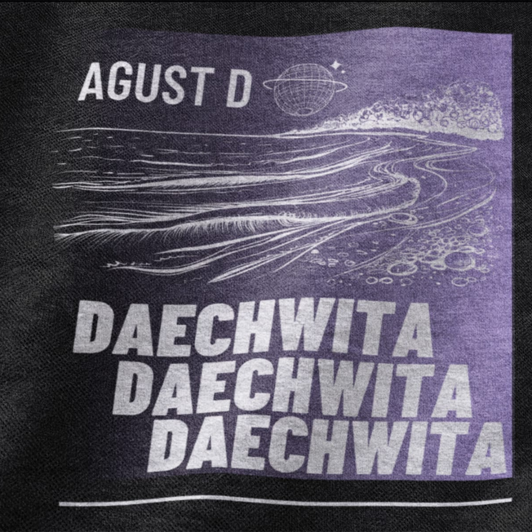 Close up front view a black oversized t-shirt featuring a bold design inspired by BTS member Suga's alter ego, August D. Ideal for BTS fans (ARMY) and K-Pop enthusiasts who love rap music and artist individuality.