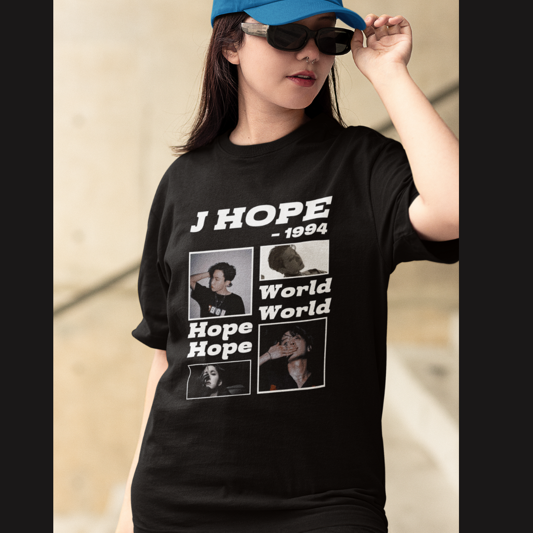 Front view of a female model wearing a black oversized t-shirt featuring a vibrant design inspired by BTS member J-Hope (Hoseok). Ideal for BTS fans (ARMY) and K-Pop enthusiasts who love dance and rap-focused music.