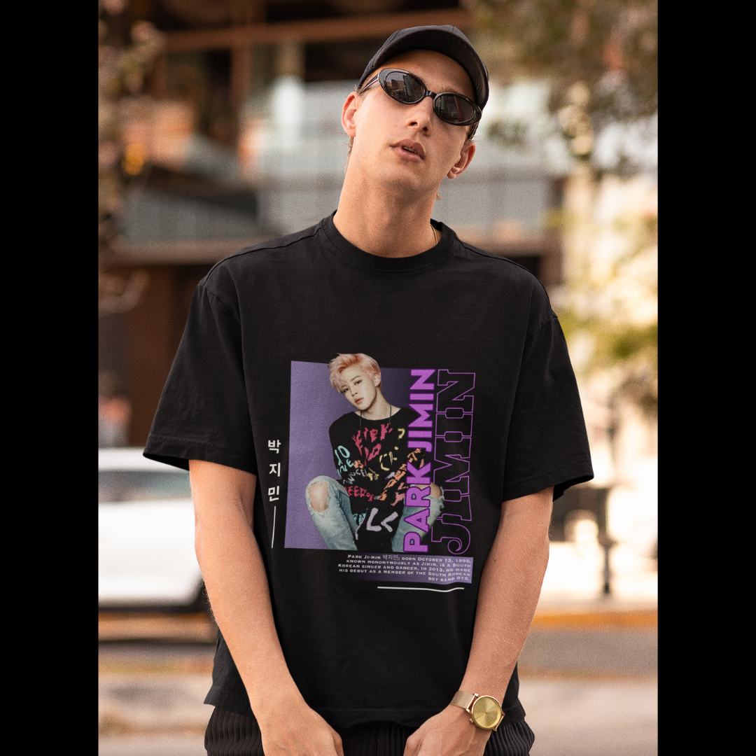 Front view of male model wearing a black oversized t-shirt featuring a bold design inspired by BTS member Park Jimin (Jimin). Ideal for BTS fans (ARMY) and K-Pop enthusiasts who love dance-focused music.