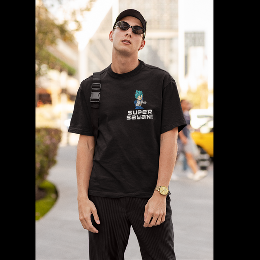 First front view of a male model wearing a black oversized t-shirt featuring multiple characters from Dragon Ball Z in their Super Saiyan forms with the text "Super Saiyans."