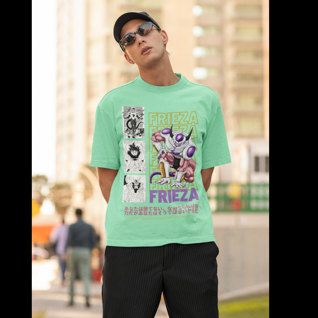 First front view of a male model wearing a mint green oversized t-shirt featuring Frieza from Dragon Ball Z with the text "Frieza."
