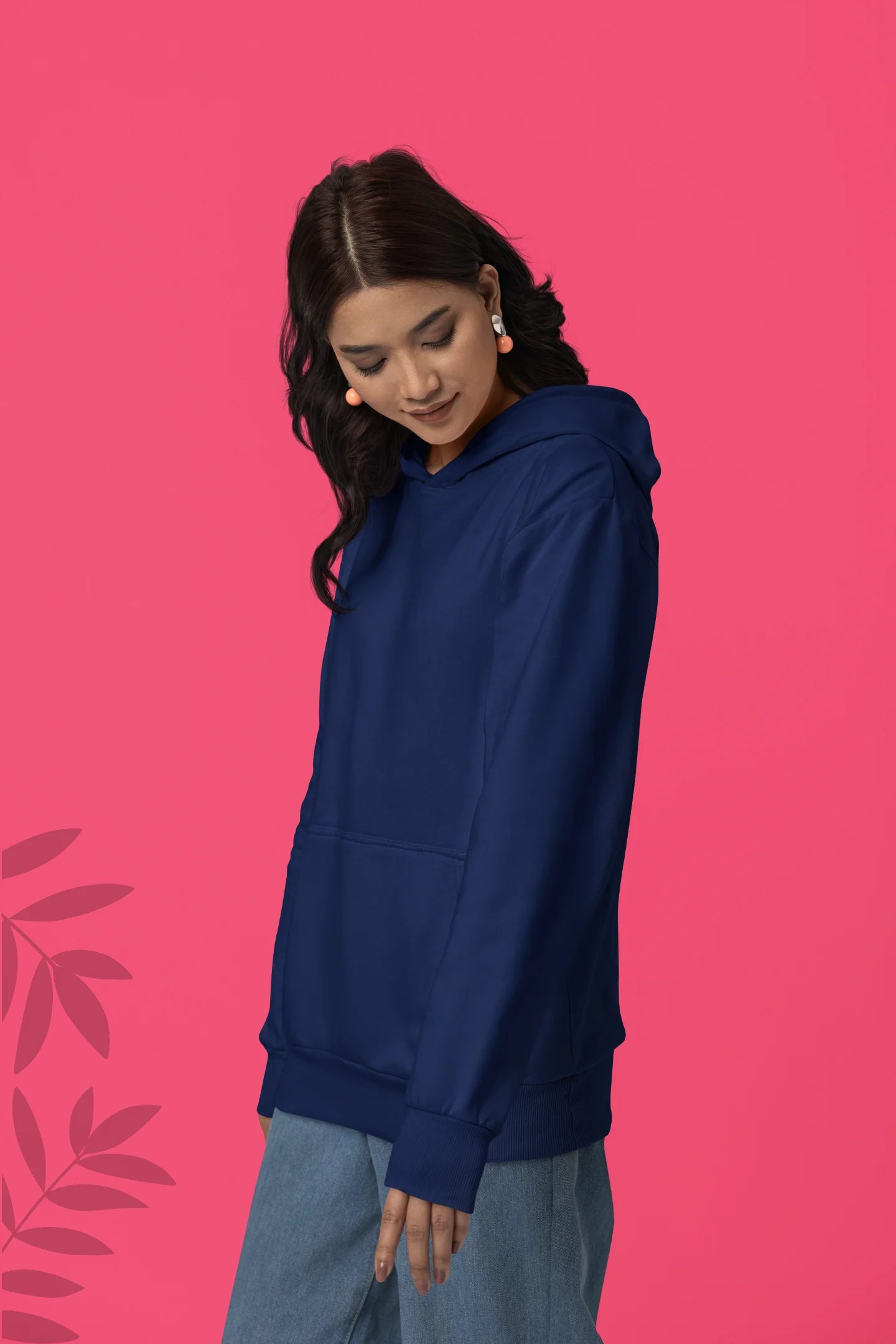 Second front view of a female model wearing a navy blue hoodie with a design of a wolf surveying a Japanese landscape.
