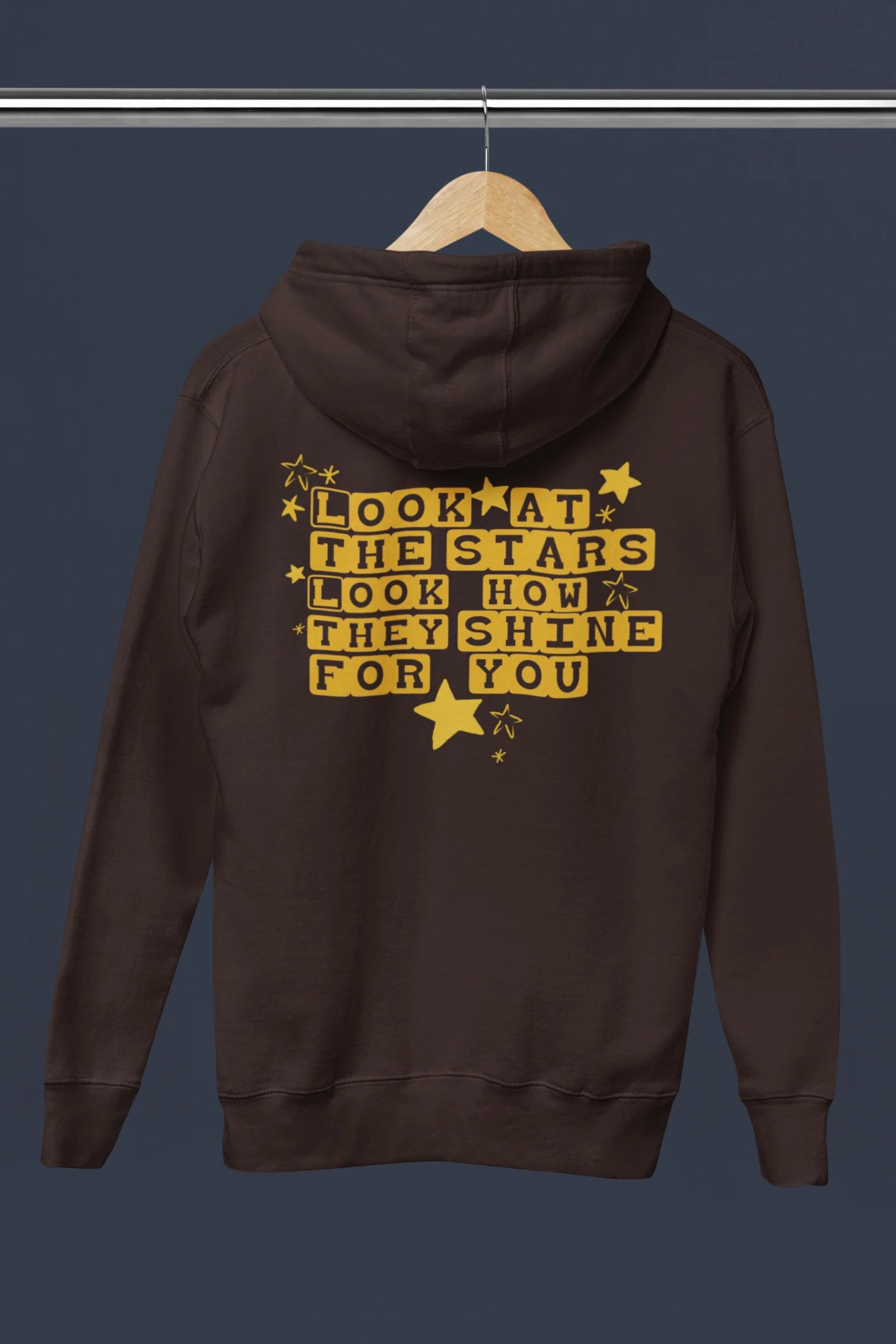 Back view of a chocolate brown hoodie with the "Yellow" album artwork by Coldplay.