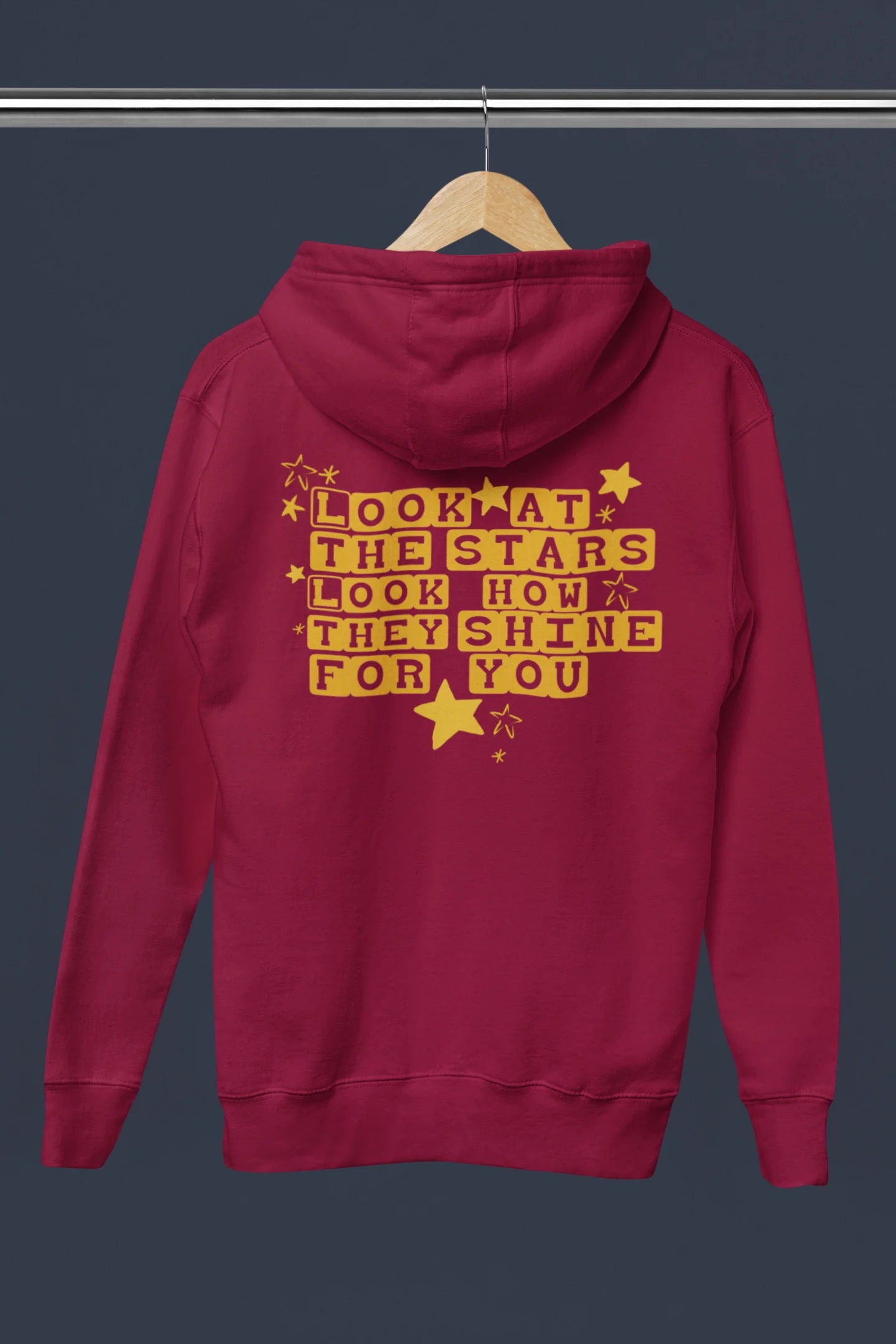Back view of a maroon hoodie with the "Yellow" album artwork by Coldplay.