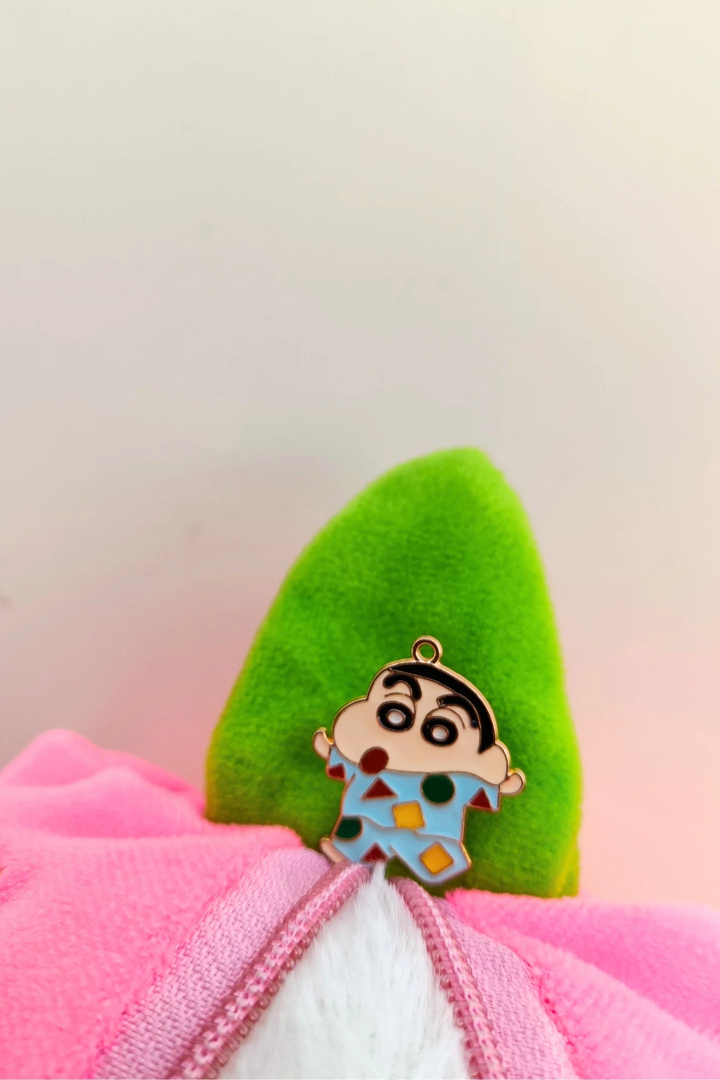 Third view of a charm featuring Shinchan waking up in the morning.