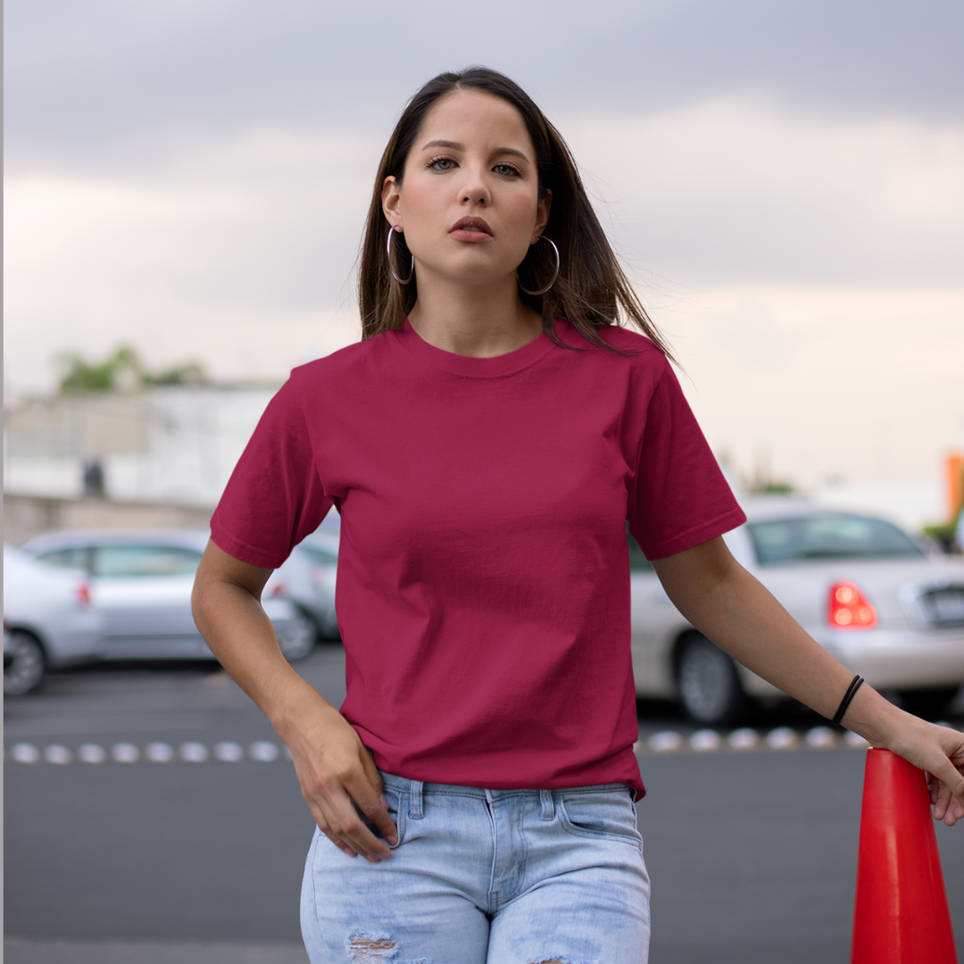Front view of a female model wearing a maroon oversized, premium quality, pure cotton t-shirt.