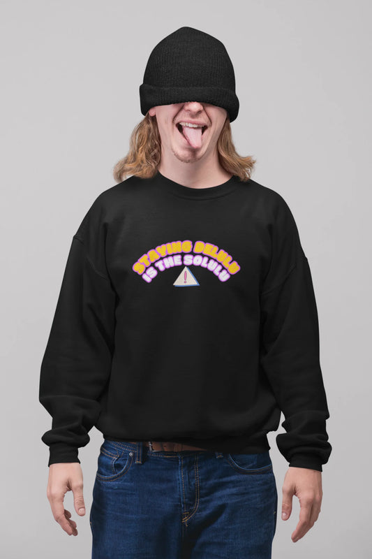 First front view of male model wearing a black sweatshirt with the hilarious message "Stay Delulu" in a bold design. Ideal for those who love trendy slang and lighthearted humor.