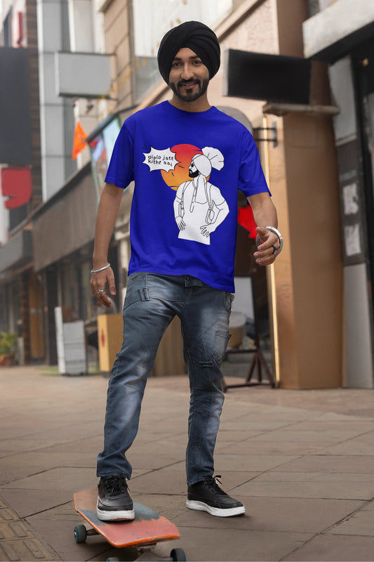 Second image of a male model wearing a royal blue oversized tshirt with a A portrait of Diljit Dosanjh wearing a stylish outfit, with the text "Diplo Jatt Kithe Aai" prominently displayed in the background. The design captures the artist's charisma and the energy of the hit song, making it a must-have for fans of Diljit Dosanjh and Diplo alike. 