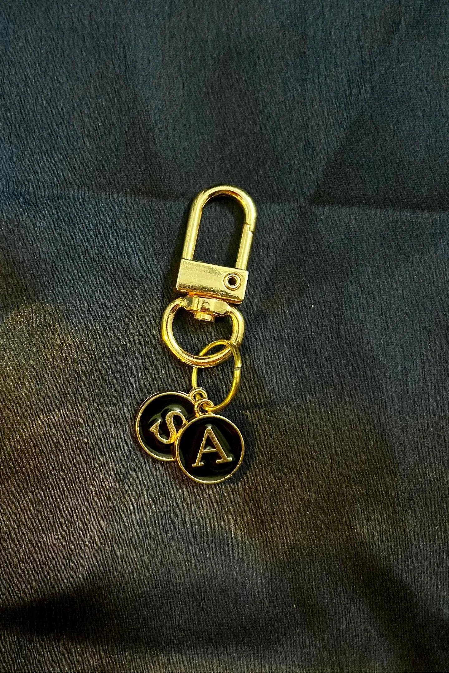 Fourth image of keychains featuring personalized initials for couples.
