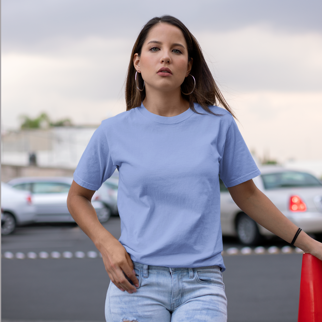 Front view of a female model wearing a sky blue oversized, premium quality, pure cotton t-shirt.