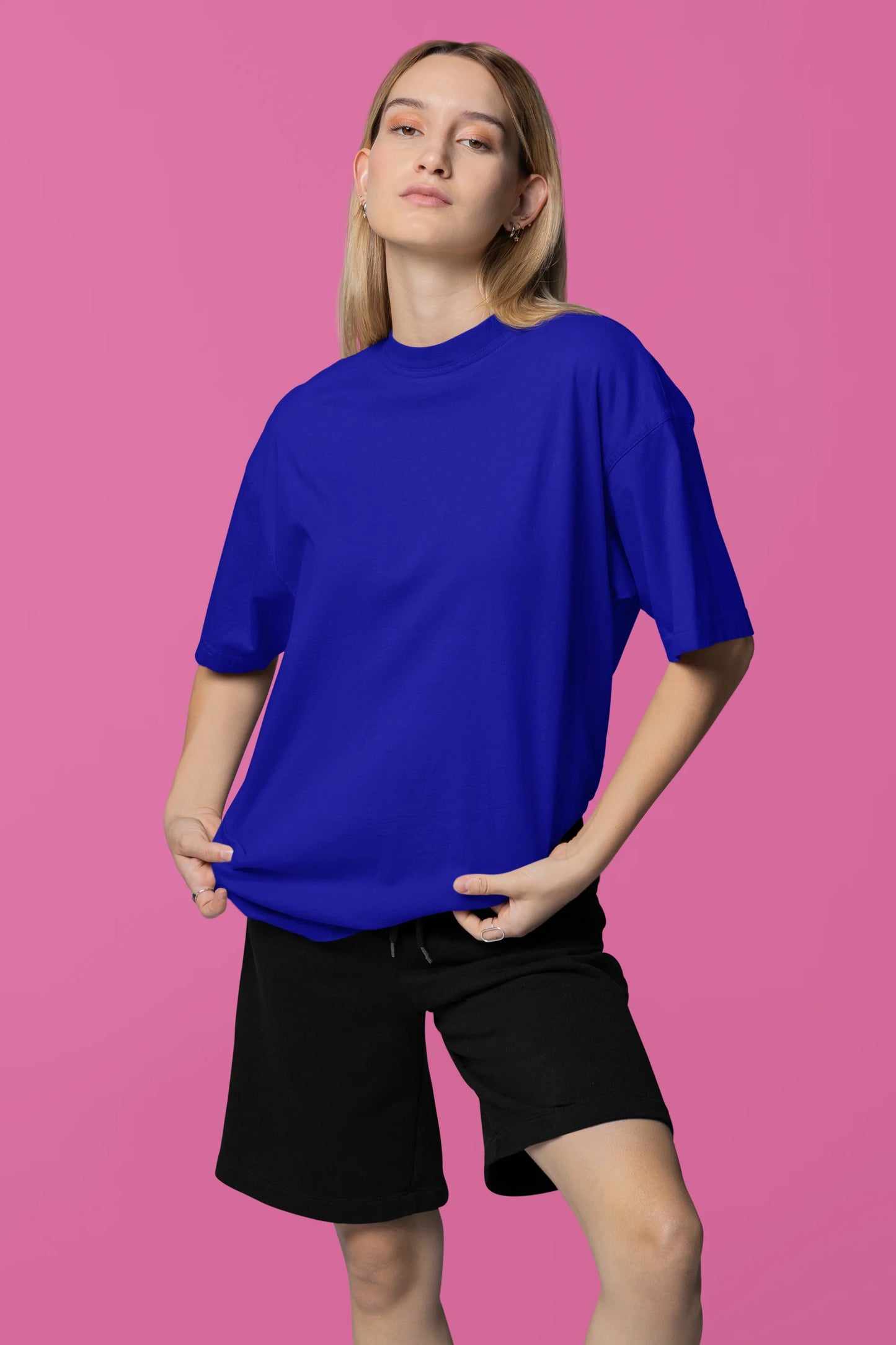 Front view of a female model wearing a royal blue oversized tee with a design of a fox and its cub in a traditional Japanese landscape.