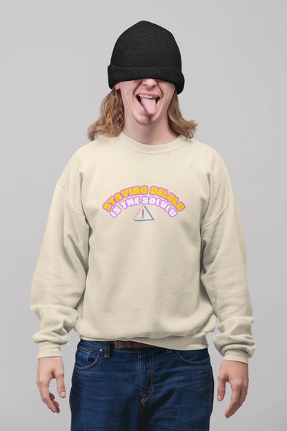 First front view of male model wearing a cream sweatshirt with the hilarious message "Stay Delulu" in a bold design. Ideal for those who love trendy slang and lighthearted humor.