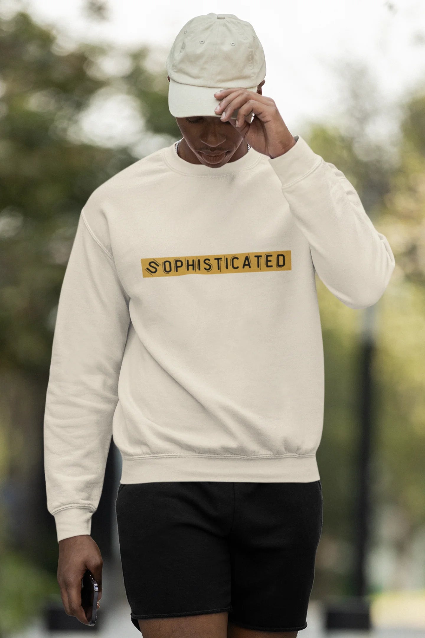 Third front view of a male model wearing a cream sweatshirt with a sophisticated brutalist design featuring a Greek god statue.