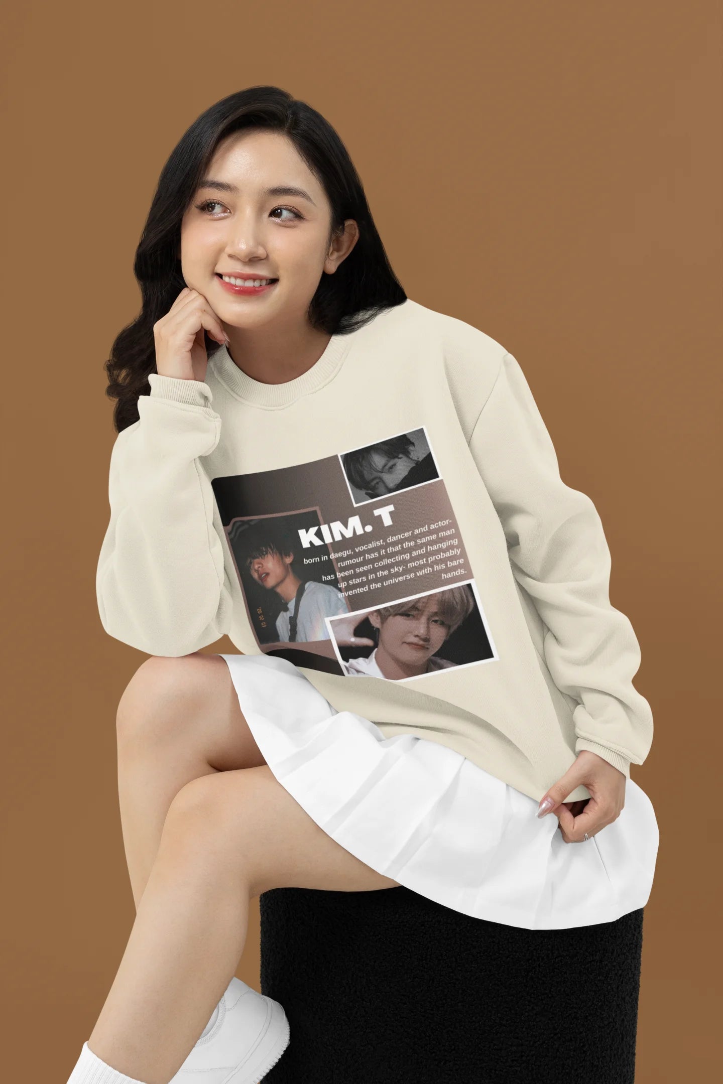 Fourth front view of female model wearing a cream sweatshirt featuring a bold design inspired by BTS member Kim Taehyung (V). Ideal for BTS fans (ARMY) and K-Pop enthusiasts.