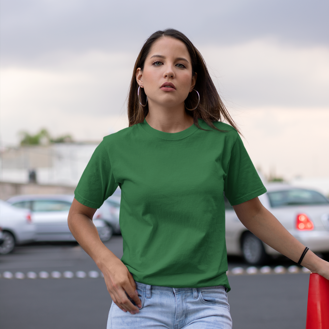Front view of a female model wearing a bottle green oversized, premium quality, pure cotton t-shirt.