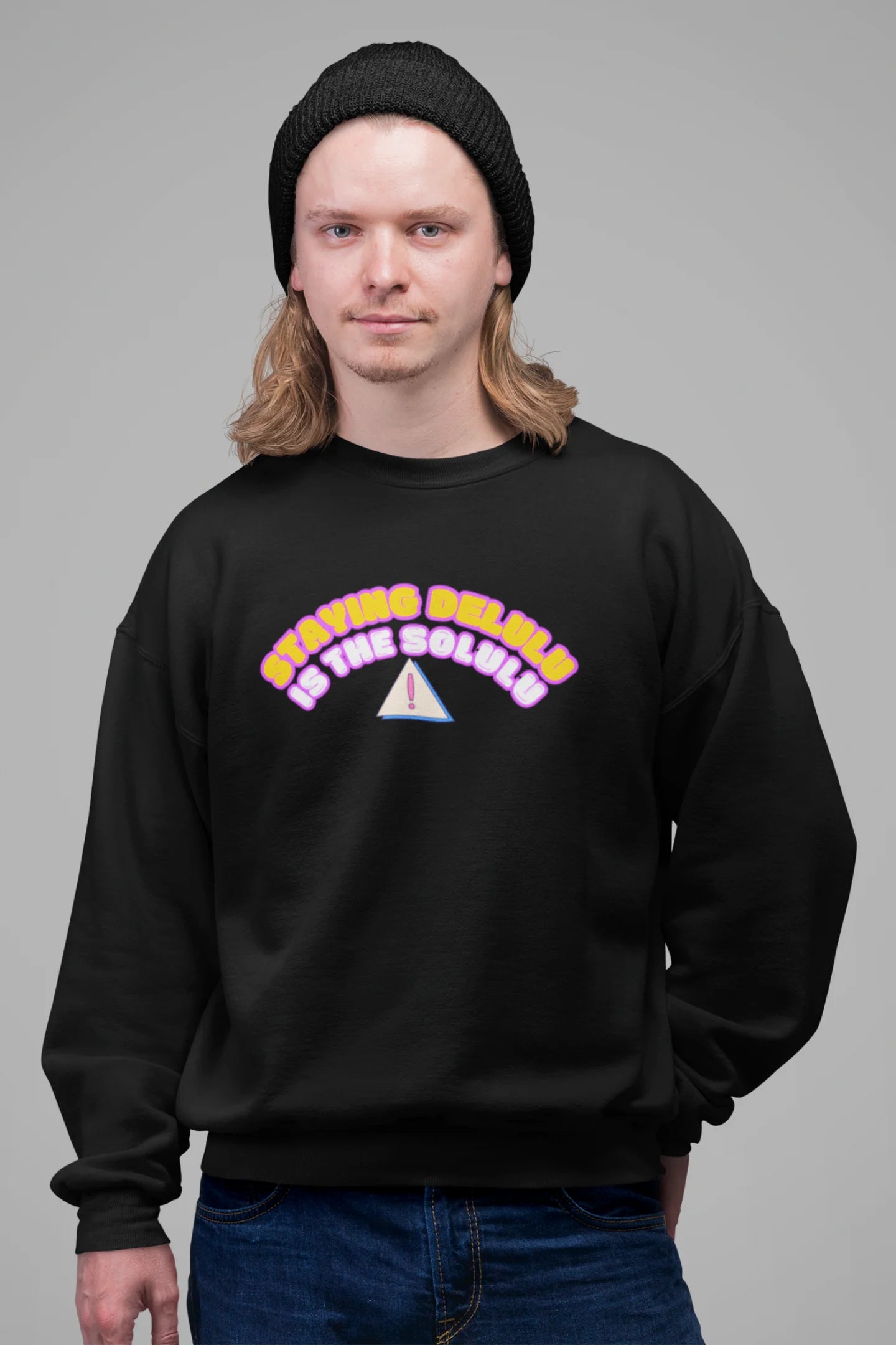 3rd front view of male model wearing a black sweatshirt with the hilarious message "Stay Delulu" in a bold design. Ideal for those who love trendy slang and lighthearted humor.