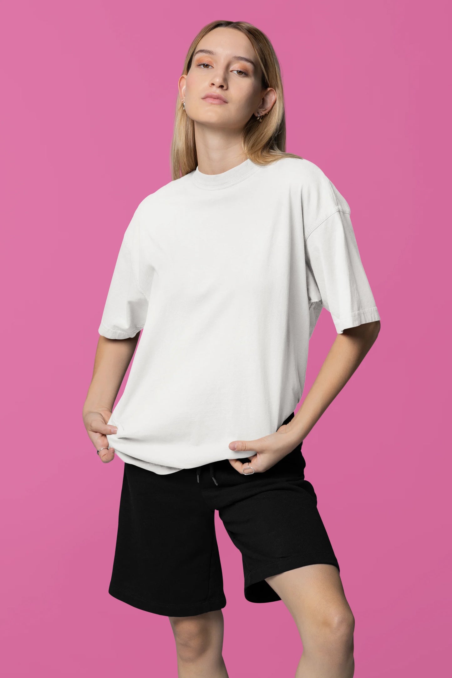 Front view of a female model wearing a off-white oversized tee with a design of a fox and its cub in a traditional Japanese landscape.