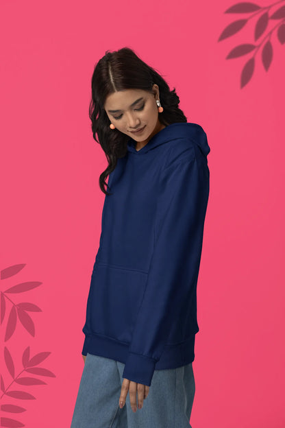 Second front view of a female model wearing a navy blue hoodie with a design of a wildcat sitting on ocean waves.