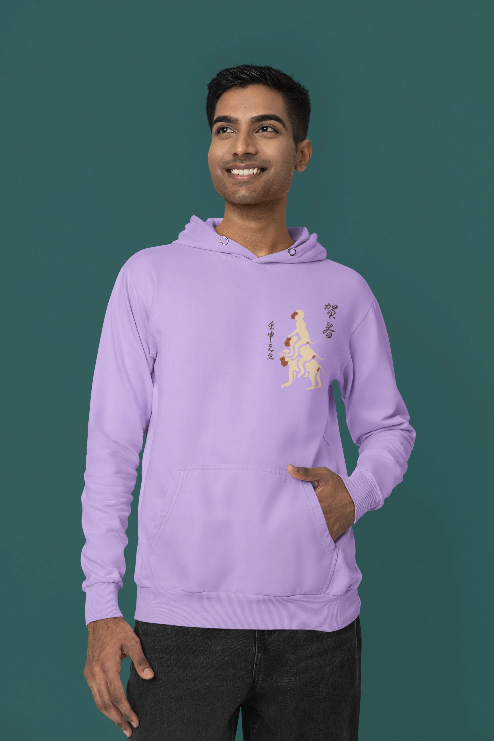 Second front view of a male model wearing a lavender hoodie with a design of the three wise monkeys: "See no evil, hear no evil, speak no evil."