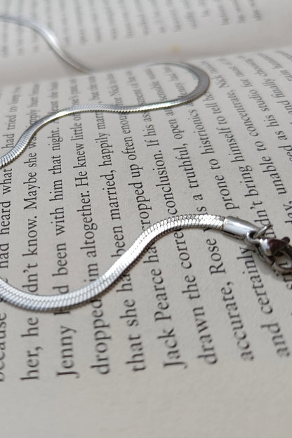 Fifth image of an anti tarnish silver chain necklace featuring a snake like design.