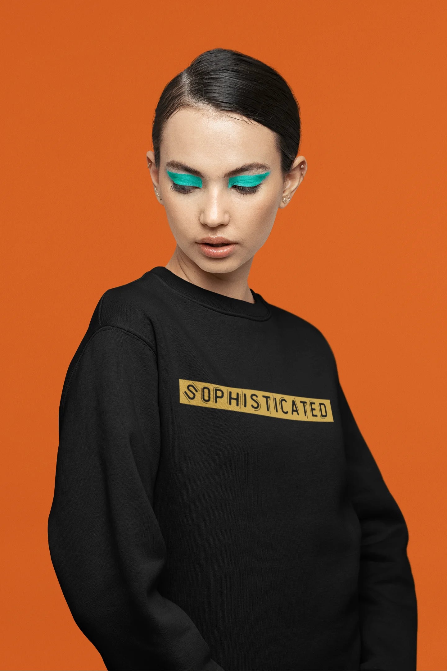 Fifth front view of a female model wearing a black sweatshirt with a sophisticated brutalist design featuring a Greek god statue.
