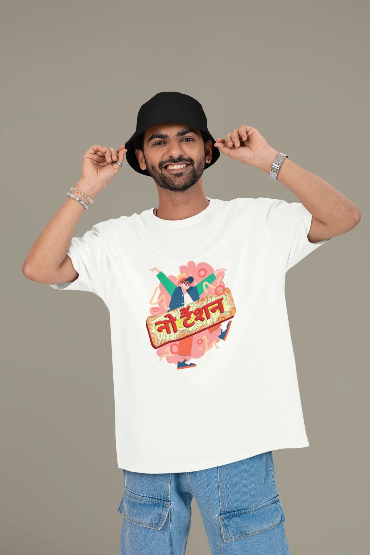 First front view of a male model wearing an off-white oversized t-shirt with the phrase "No Tension" in a relaxed, unique script.