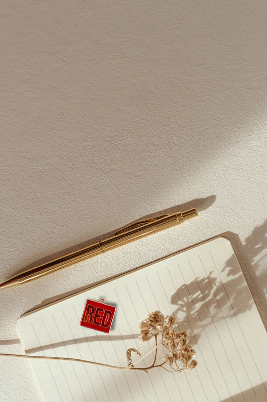 First image of a taylor swift RED era themed charm for swifties.
