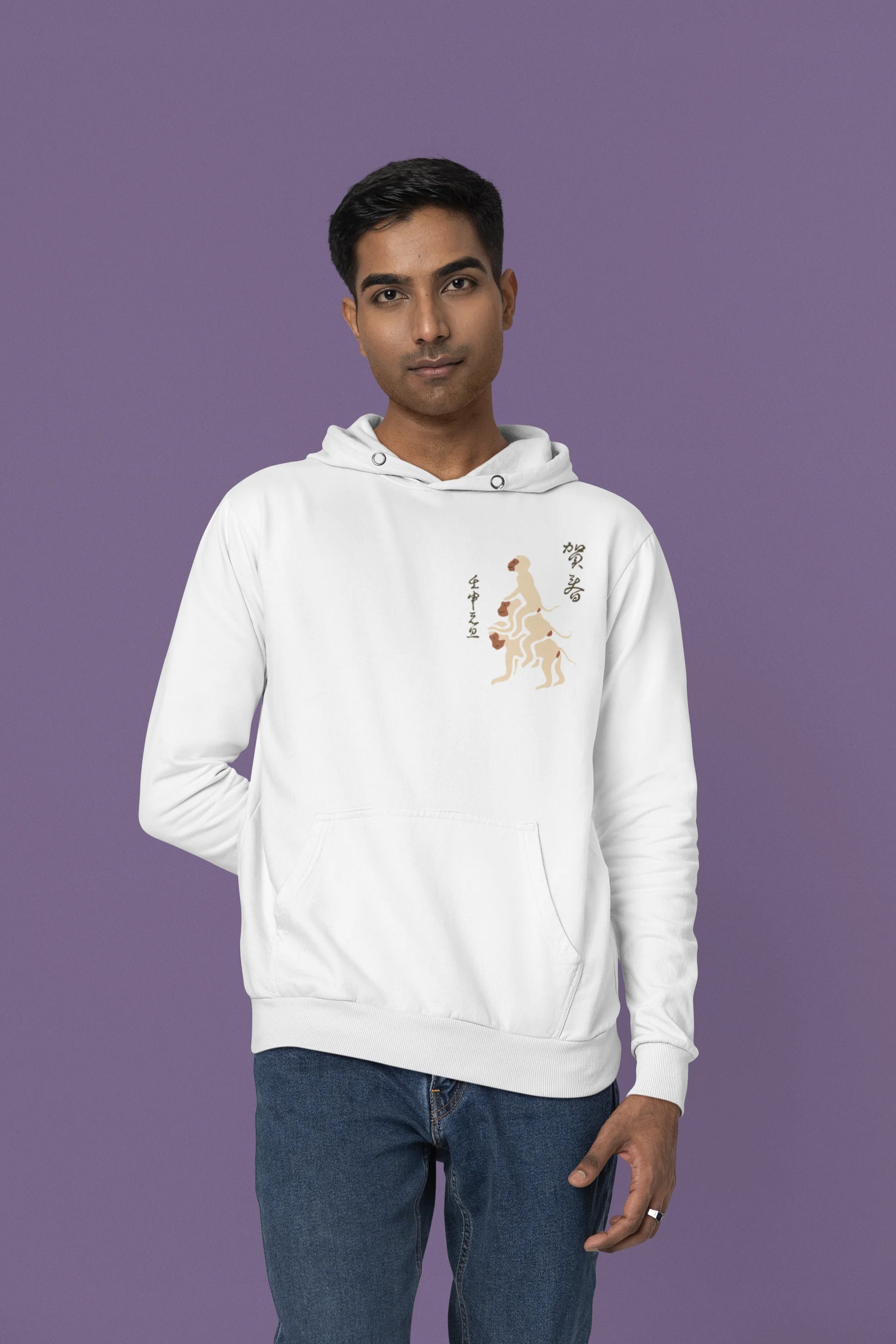Fourth front view of a male model wearing a white hoodie with a design of the three wise monkeys: "See no evil, hear no evil, speak no evil."