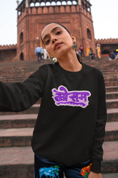 5th front view of a female model wearing a black colored oversized graphic t-shirt featuring the word "awesome" in a Hindi script.