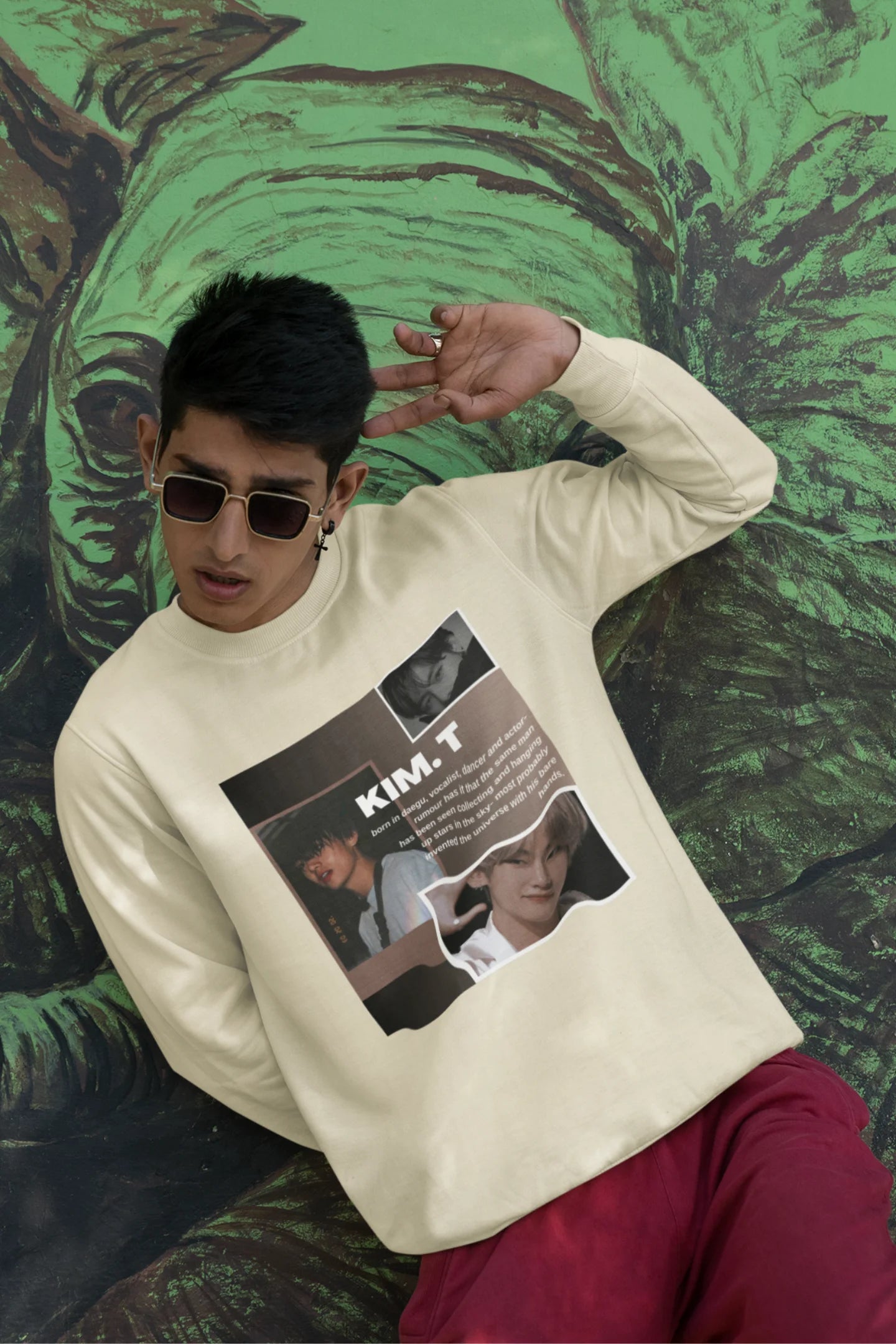 First front view of male model wearing a cream sweatshirt featuring a bold design inspired by BTS member Kim Taehyung (V). Ideal for BTS fans (ARMY) and K-Pop enthusiasts.