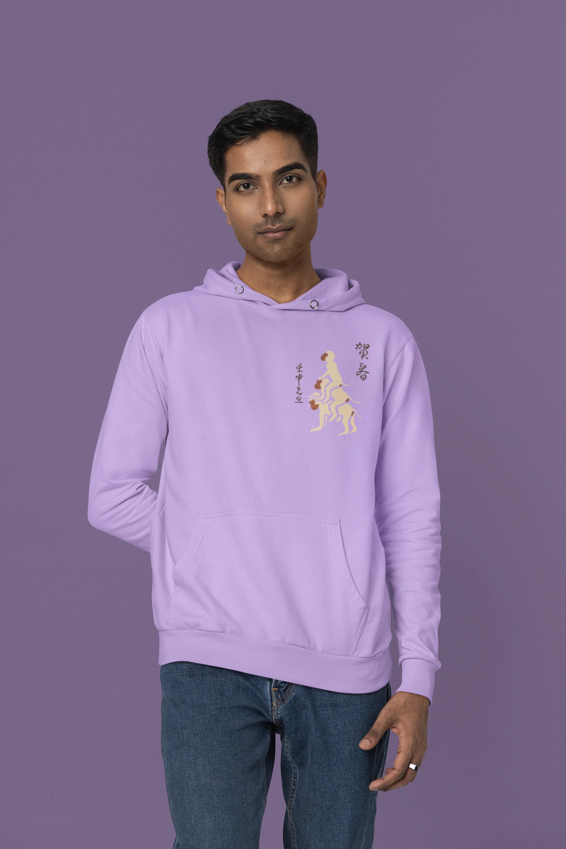 Third front view of a male model wearing a lavender hoodie with a design of the three wise monkeys: "See no evil, hear no evil, speak no evil."