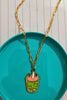 2nd view of a gold chain necklace featuring a small pendant of a frog themed boba cup.