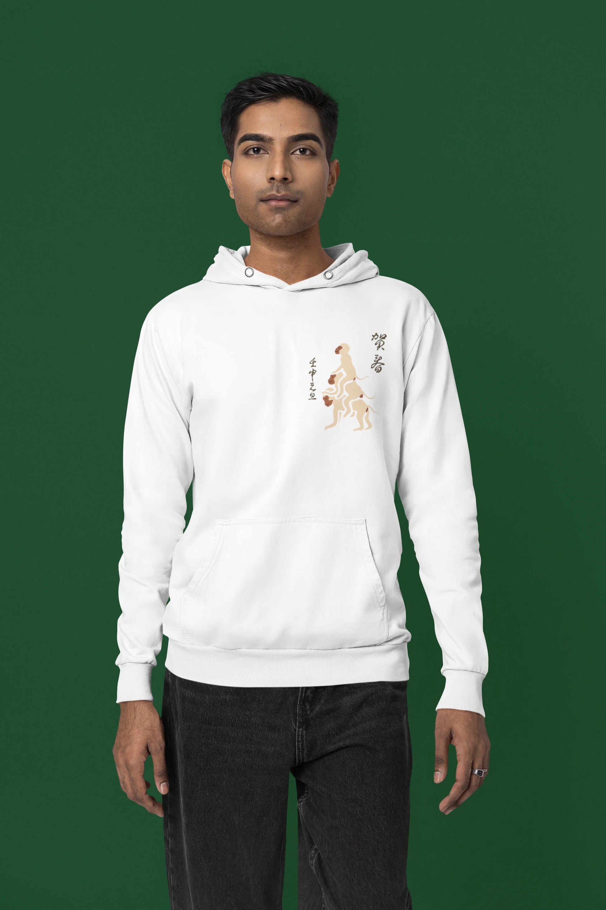 Third front view of a male model wearing a white hoodie with a design of the three wise monkeys: "See no evil, hear no evil, speak no evil."