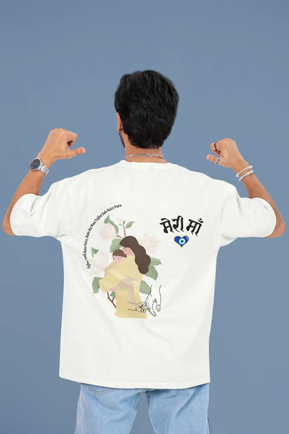 Back view of a male model wearing an off-white oversized t-shirt featuring a design depicting a mother tenderly holding a baby