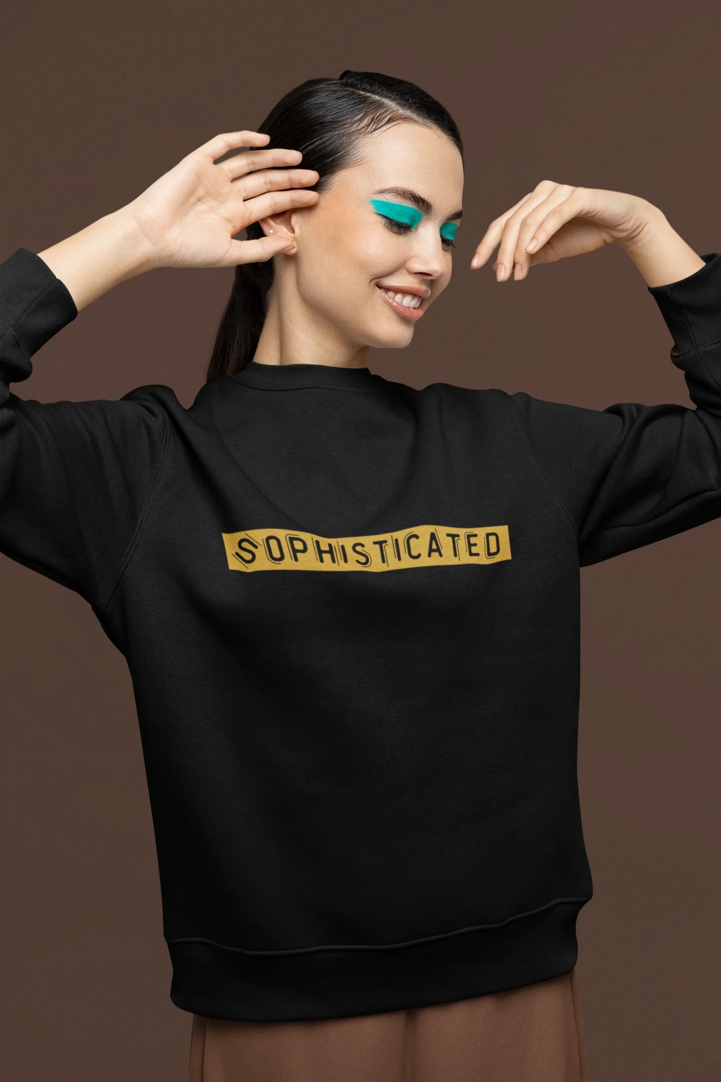 Second front view of a female model wearing a black sweatshirt with a sophisticated brutalist design featuring a Greek god statue.