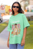 First image of woman wearing mint green oversized t-shirt featuring 'Adore You' inspired design - ideal for fans of Harry Styles and One Direction