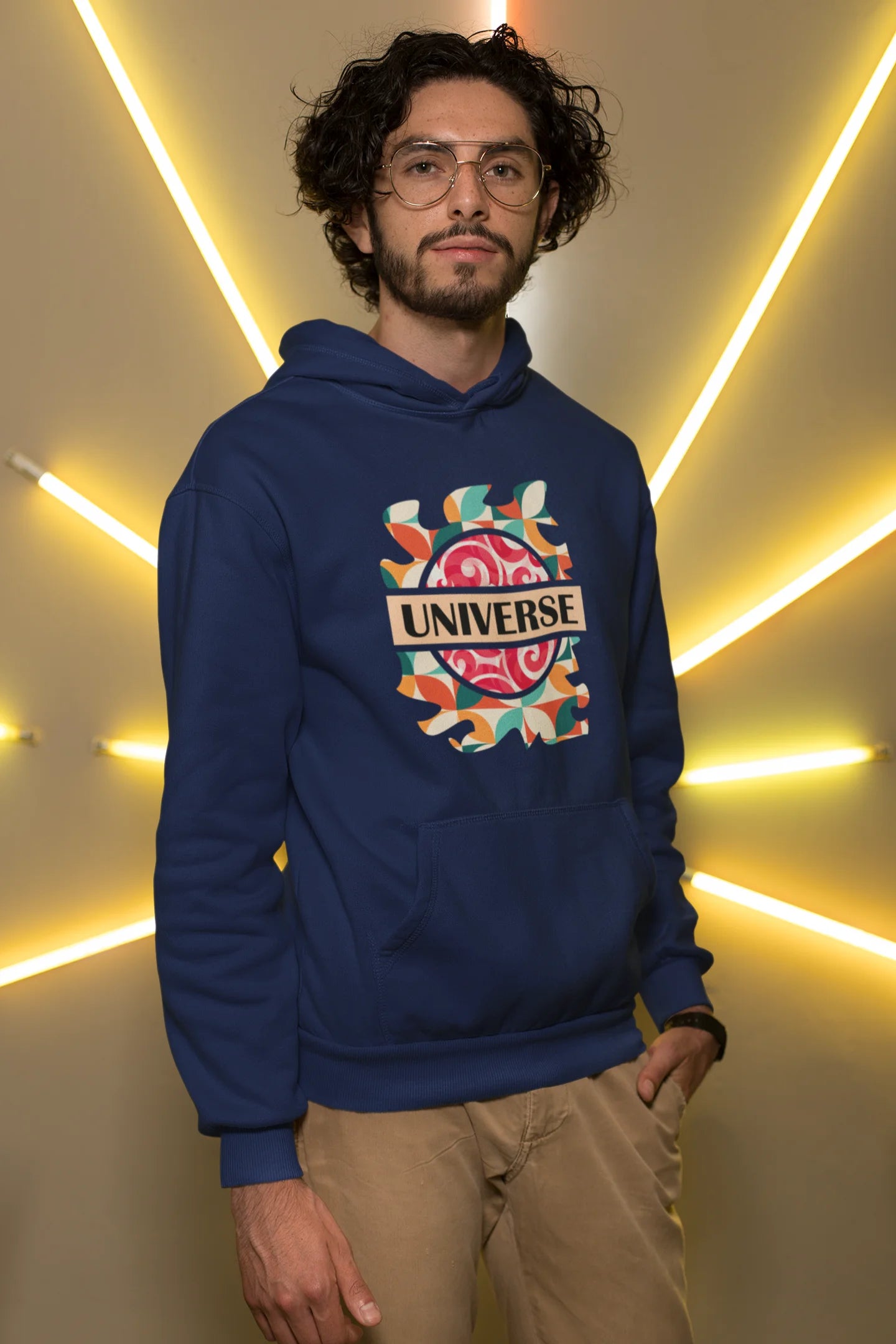 2nd front view of a male model wearing an royal blue hoodie with a cosmic Universe design inspired by Coldplay.