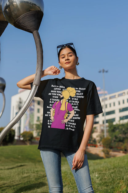 First image of a female model wearing a black oversized t-shirt with a Diljit Dosanjh portrait on a t-shirt with his album titles written in the background.