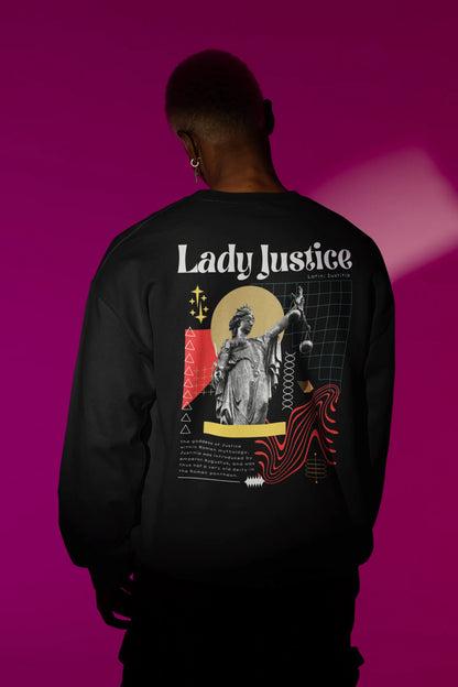 Back view of a male model wearing a black sweatshirt with a brutalist Lady Justice statue design.