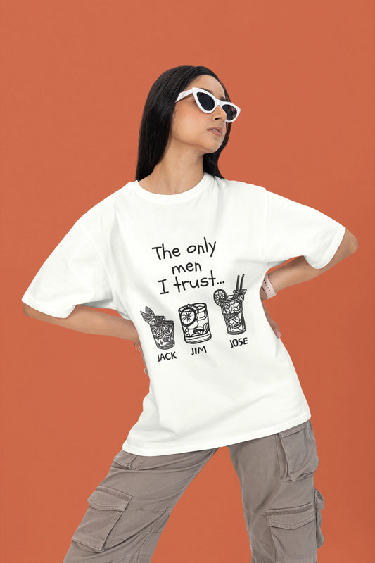 2nd front view of a female model wearing a off-white oversized t-shirt with the text "Only Men I Trust: Jack, Jim, and Jose" and three drink designs underneath.