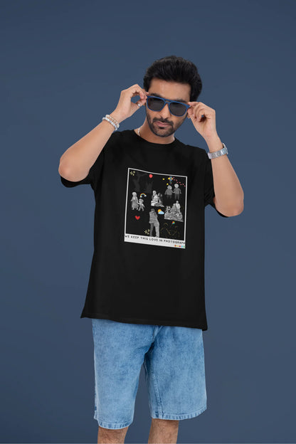 3rd front view of a male model wearing a black oversized t-shirt featuring a design that represents cherished memories, inspired by Ed Sheeran's "Photograph."