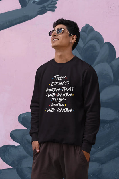First image of male model wearing black sweatshirt with F.R.I.E.N.D.S series inspired designs, embodying Phoebe's unique humor with the quote 'They Know We Know'