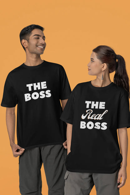 Second image of a smiling couple wearing matching black oversized tees, one with "The Boss" and the other with "The Real Boss" printed on them.