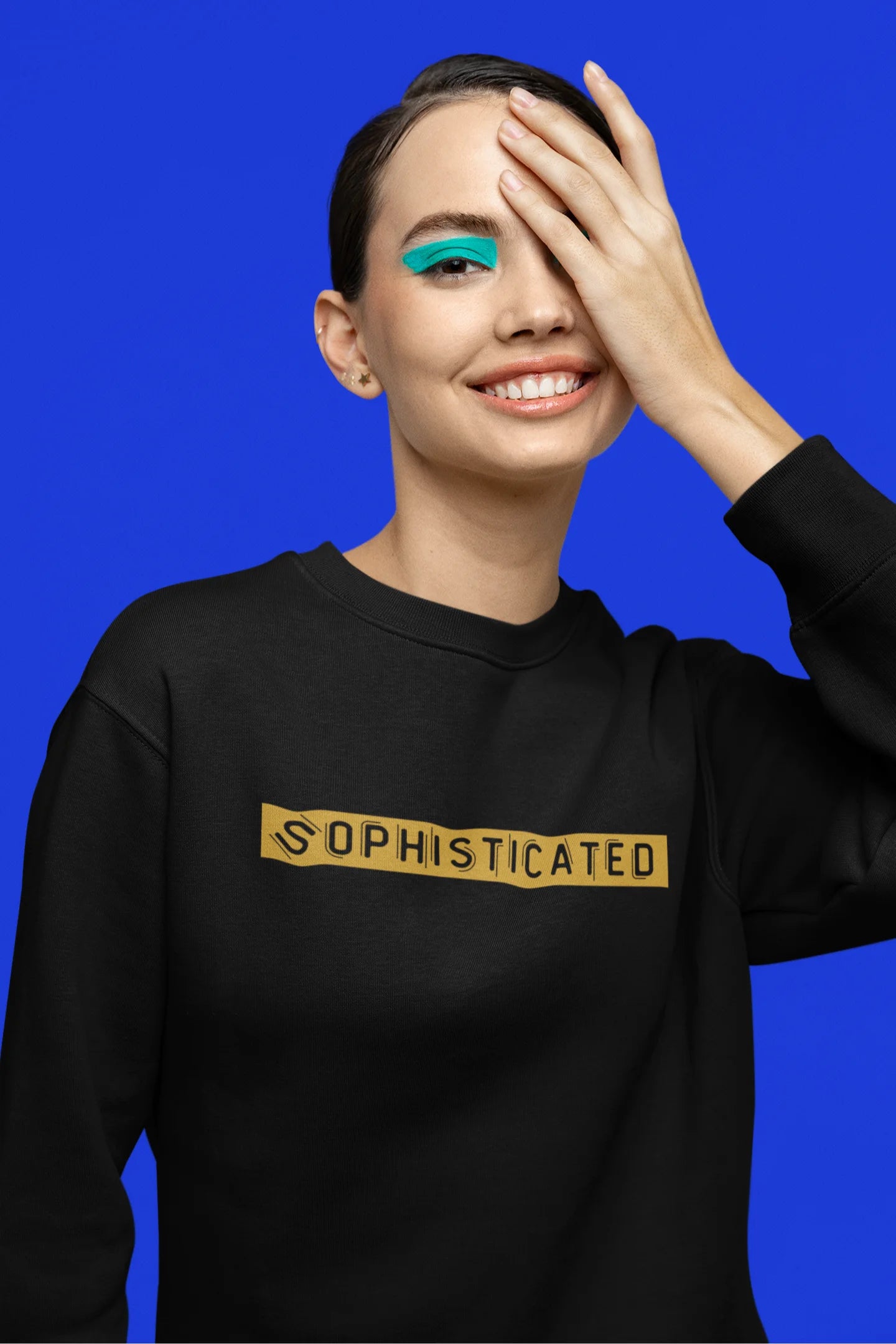 Fourth front view of a female model wearing a black sweatshirt with a sophisticated brutalist design featuring a Greek god statue.
