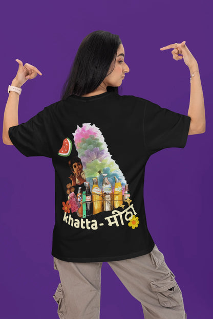 Back view of a female model wearing a black oversized t-shirt with a design representing "Bachpan" (childhood) and the concept of "Khatta Mitha" (sweet and sour).
