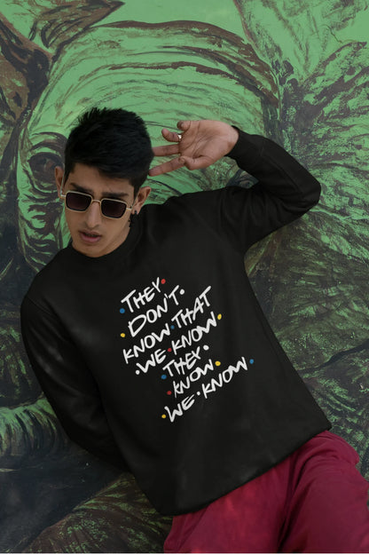 Second image of female model wearing black sweatshirt with F.R.I.E.N.D.S series inspired designs, embodying Phoebe's unique humor with the quote 'They Know We Know'