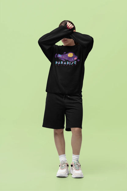 Fourth front view of a female model wearing an black sweatshirt with the "Paradise" album artwork by Coldplay.